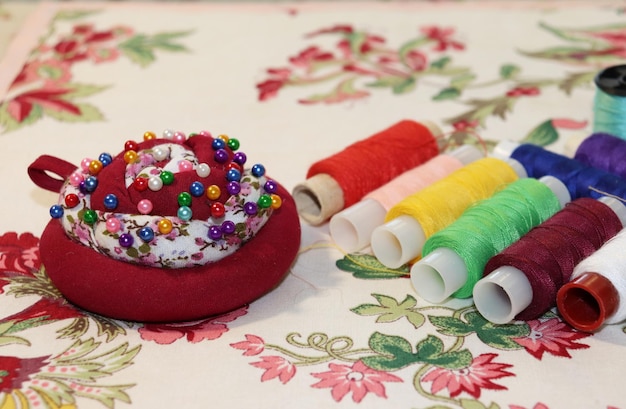 detail of hand embroidery threads and needles